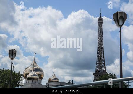 Eiffel Tower, street lamps and the Russian cathedral of the holy trinity in Paris, France, Europe Stock Photo