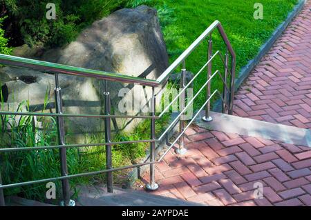 railing and pavement in recreation areas and near architectural buildings Stock Photo