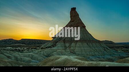 Desert landscape in Sunset light with beautiful colors at Bardenas Reales with Castil de Tierra Peak Background in Spain, Europe Stock Photo