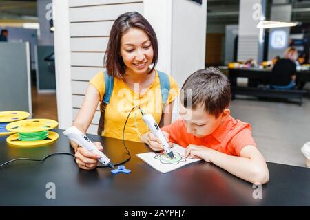 Creative boy with 3d pen learning to draw Stock Photo