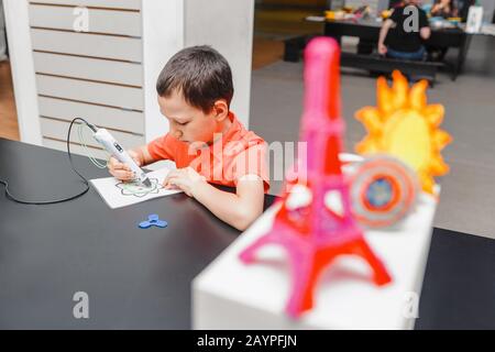 Creative boy with 3d pen learning to draw Stock Photo