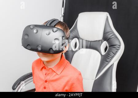 Children experiencing virtual reality in VR glasses Stock Photo