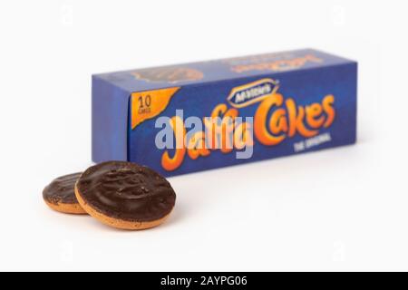 Some McVitie's Jaffa Cakes shot on a white background along with the product's box packaging. Stock Photo