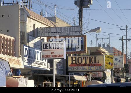 Nuevo Progreso, Mexico: Signs on main commercial street catering to American tourists in border town near Progreso Texas.  ©Bob Daemmrich Stock Photo