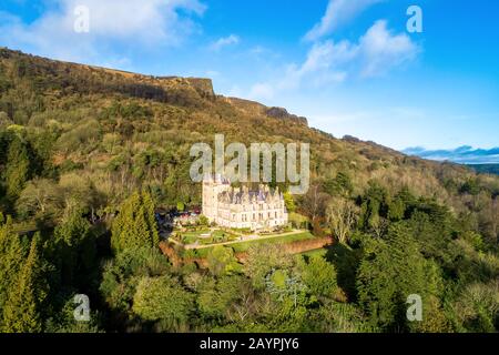 Cave Hill Country Park and Belfast castle, built in 19th century. Tourist attraction  in Belfast, Northern Ireland. Aerial view Stock Photo