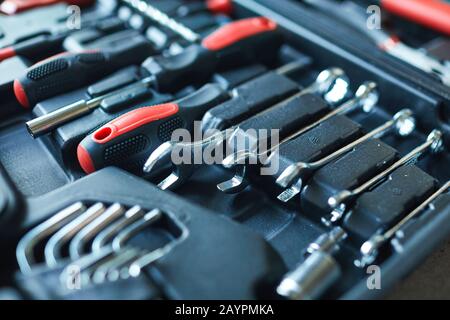 Close up of black open tool box with set of wrenches and screwdriver on construction site, copy space Stock Photo