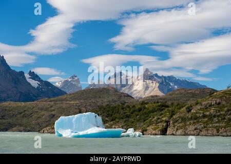 An iceberg is floating in Grey Lake (Lago Grey) in Torres del Paine National Park in southern Chile. Stock Photo