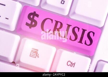 Writing note showing Crisis. Business concept for time when difficult or important decision must be made danger Stock Photo