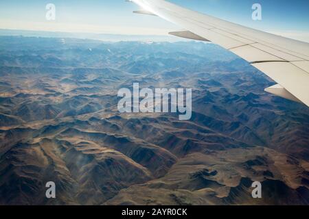looking down onto eroded deset landcape in Chile from the air. Stock Photo