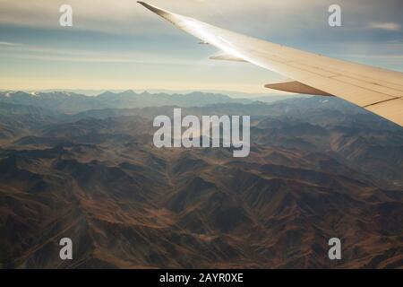looking down onto eroded deset landcape in Chile from the air. Stock Photo