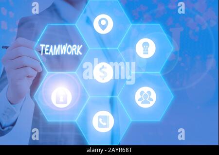 Handwriting text writing Teamwork. Conceptual photo combined action of group especially when effective and efficient Stock Photo