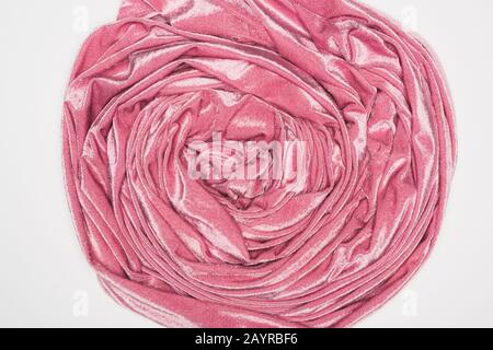 Top view of twisted pink velvet cloth isolated on white Stock Photo