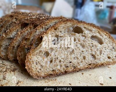 Freshly baked & cut organic seeded whole wheat bread. Stock Photo