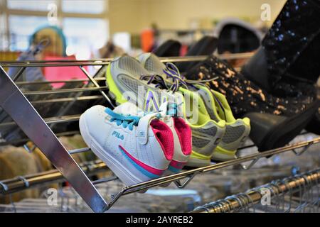colorful shoes for sale at a Goodwill store in New Jersey USA donated items  lightly used and near new cheap Stock Photo - Alamy