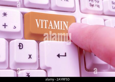 Handwriting text writing Vitamin. Conceptual photo group of organic compounds which are essential for normal growth Stock Photo