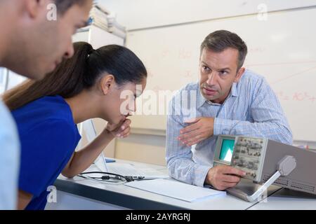 sound engineer working at mixing panel school Stock Photo