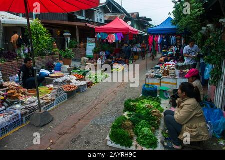 A scene from the early morning market in the UNESCO world heritage town of Luang Prabang in Central Laos. Stock Photo