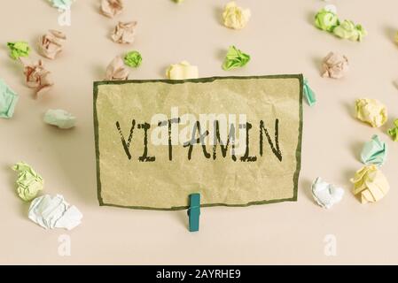Handwriting text writing Vitamin. Conceptual photo group of organic compounds which are essential for normal growth Colored crumpled papers empty remi Stock Photo