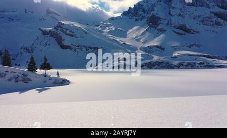 Fantastically beautiful snow landscape in the mountains - aerial flight footage
