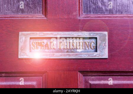 Handwriting text writing Spear Phishing. Conceptual photo Sending fake emails to extract financial data from user Old retro mailbox on the wooden door Stock Photo