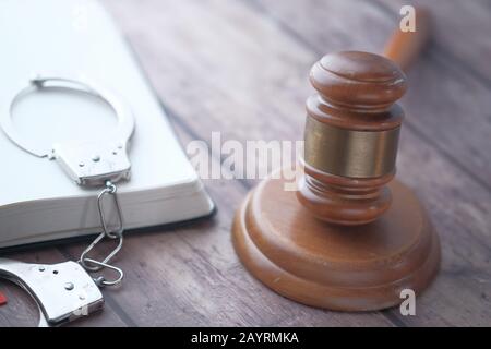 Close up of gavel, book and handcuff  Stock Photo