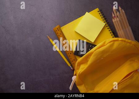 top view of school bag and pencils on table. Stock Photo