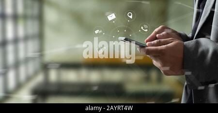 nternet online communication interface , technology concept Man using smartphone Stock Photo