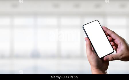 Closeup image of male hands with smartphone sms message on chat man typing an sms message to his friends Stock Photo