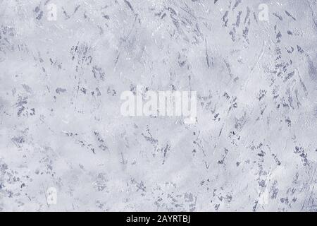 Blue spotted scratched background close up, gray rough cement texture backdrop, grey grunge textured wall, light color board with dark particles Stock Photo