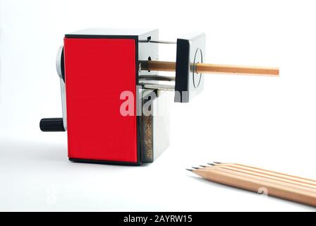 Study materials containing a black pencil and a Black pencil sharpener on a  white background Stock Photo - Alamy