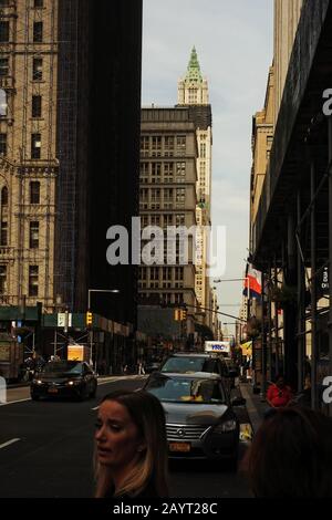 Looking up Broadway from Trinity church towards The Woolworth Building Stock Photo