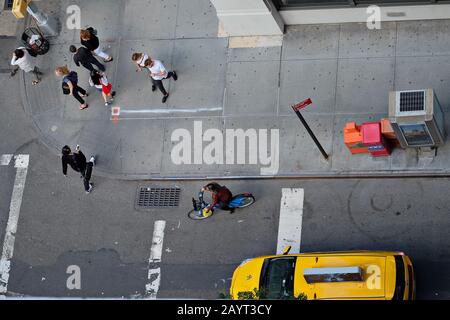 Looking down on New York City Pavement and Pedestrians from above for a plan-view of city life Stock Photo
