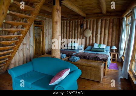 Interior of a cabin at Chelinda Lodge on the Nyika Plateau, Nyika National Park in Malawi. Stock Photo