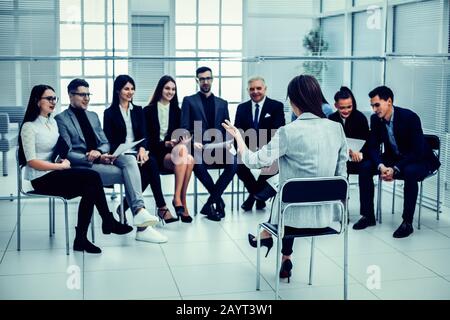 businesswoman makes a report at a meeting with the business team. business and education Stock Photo