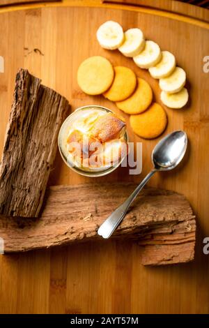 Banana Nilla Wafer Pudding Desert on Wood Cutting Board with Spoon Food Photography