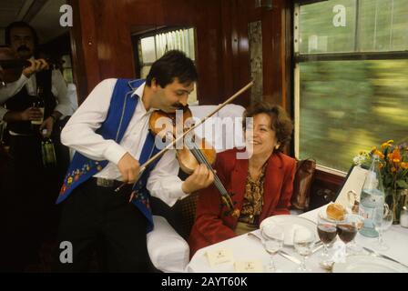 Hungarian gypsy musician performing traditional gypsy music on the Orient Express Train near Budapest, Hungary. Stock Photo