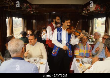 Hungarian gypsy musician performing traditional gypsy music on the Orient Express Train near Budapest, Hungary. Stock Photo