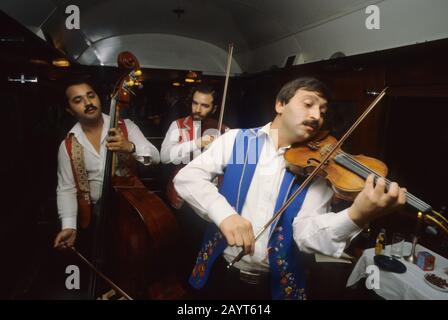 Hungarian gypsy musician performing traditional gypsy music on the Orient Express Train near Budapest, Hungary. Stock Photo