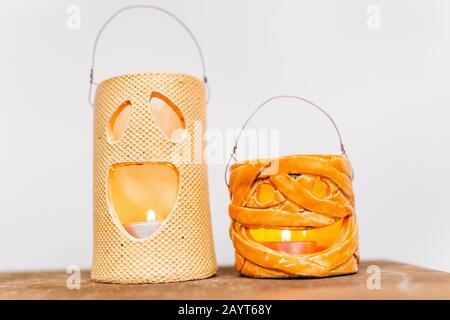 Halloween decorations with ceramic pumpkin and candlesticks Stock Photo