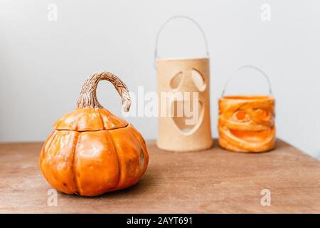 Halloween decorations with ceramic pumpkin and candlesticks Stock Photo