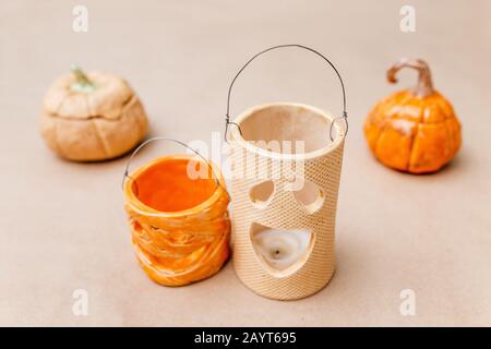 Halloween decorations with ceramic pumpkin and candlesticks Stock Photo