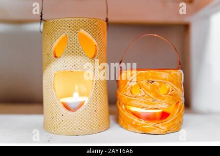 Halloween decorations with ceramic pumpkin and candlesticks Stock Photo