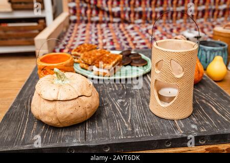 Halloween decorations with ceramic pumpkin and candlesticks Stock Photo
