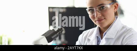 Smiling biomedical researcher in eyewear Stock Photo
