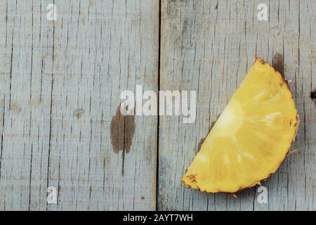 Ripe of pineapple sliced on a wooden. Stock Photo