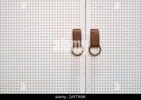 Closeup view at mesh doors with leather handles Stock Photo