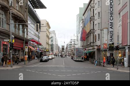 Berlin, Germany - December 20, 2019: People visit famous Checkpoint Charlie in Berlin. During the Cold War it was the best known crossing of Berlin Wa Stock Photo