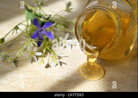 Honey Dripping From A Jar on Table Stock Photo