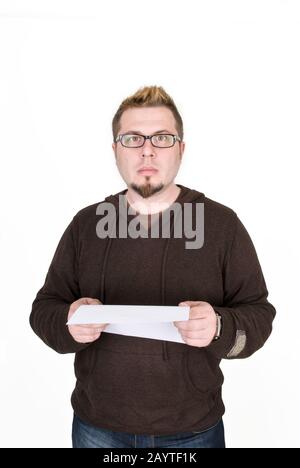 The man is puzzled and reads a document Stock Photo