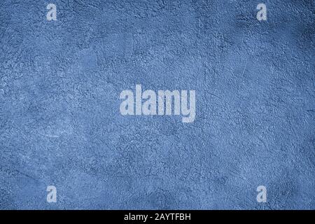 Classic blue stucco background close up, painted rough cement texture backdrop, grunge concrete textured wall, art decorative plaster board Stock Photo